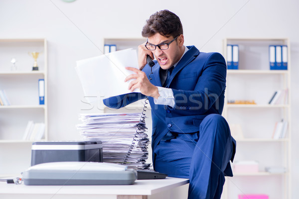 Businessman making copies in copying machine Stock photo © Elnur