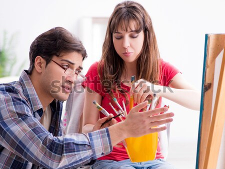 Artist coaching student in painting class in studio Stock photo © Elnur