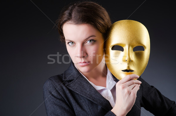 Woman with mask in hypocrisy concept Stock photo © Elnur