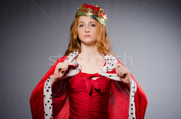 Queen in red dress in studio Stock photo © Elnur