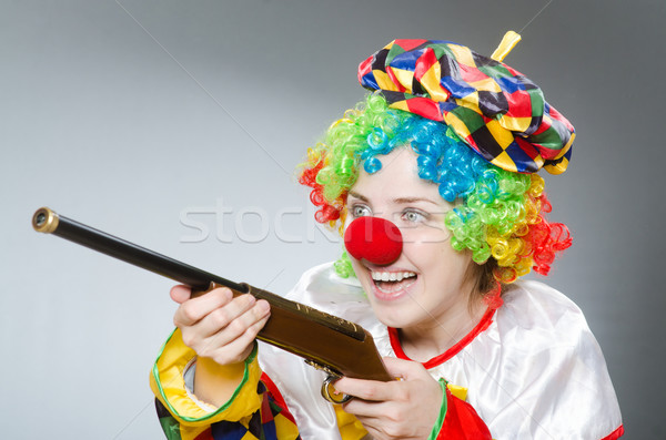 Clown with rifle isolated on white Stock photo © Elnur