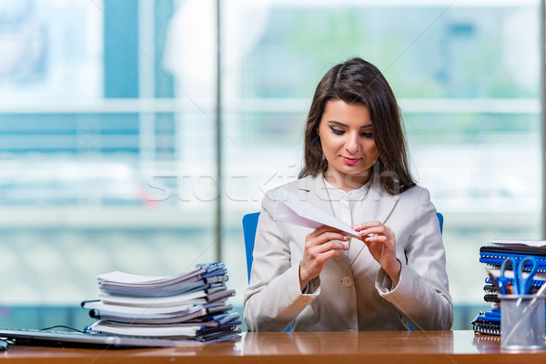 Businesswoman sitting at the office desk Stock photo © Elnur