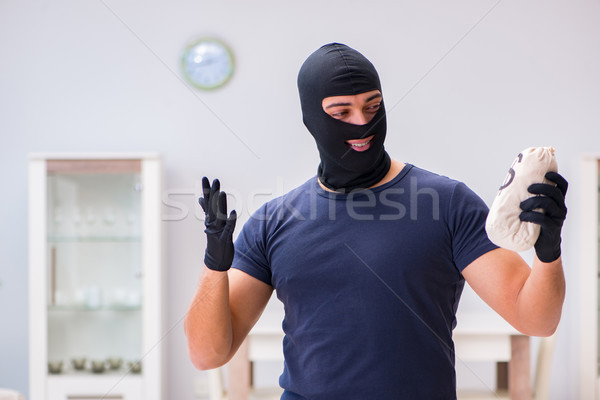 Robber wearing balaclava stealing valuable things Stock photo © Elnur