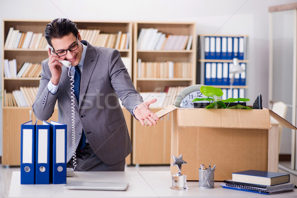Young businessman moving offices after being made redundant Stock photo © Elnur
