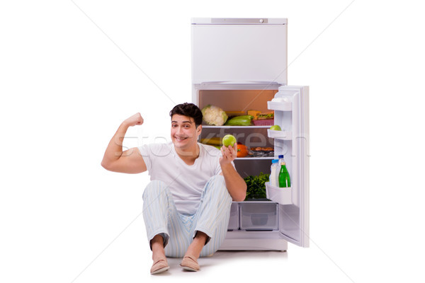 The man next to fridge full of food Stock photo © Elnur