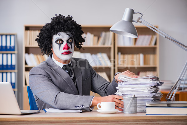 Stock photo: Clown businessman working in the office