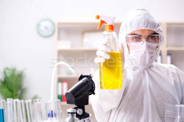 Chemist checking the quality of bathroom supplies Stock photo © Elnur