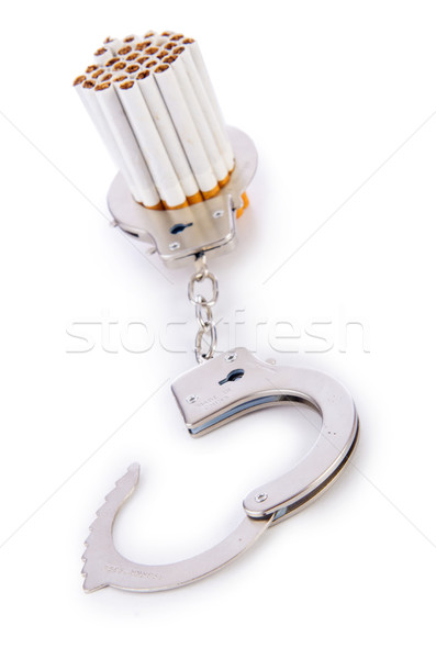 Addition concept with cigarettes and handcuffs Stock photo © Elnur