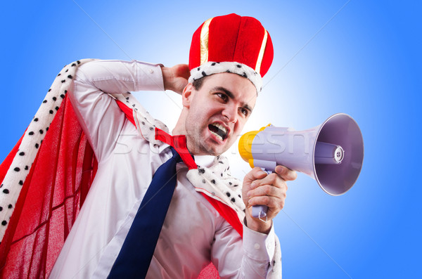 Stock photo: King businessman with loudspeaker isolated on white