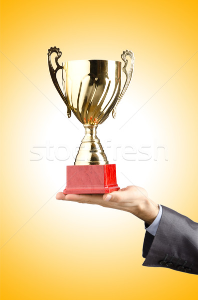 Man being awarded with golden cup Stock photo © Elnur