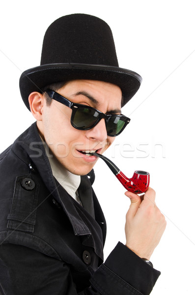 Young detective in black coat holding magnifying glass isolated  Stock photo © Elnur