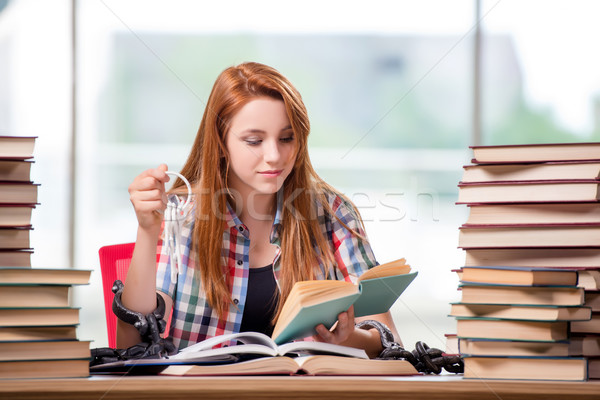 Student with stacks of books preparing for exams Stock photo © Elnur