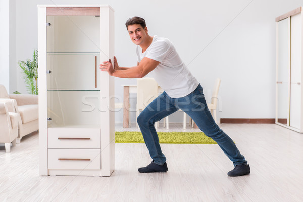 Man moving furniture at home Stock photo © Elnur