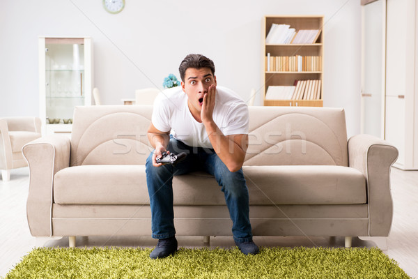 Stock photo: Man addicted to computer games