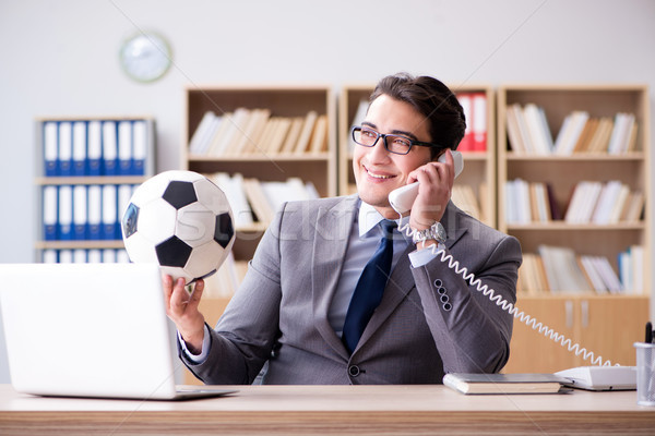 Businessman with football ball in office Stock photo © Elnur