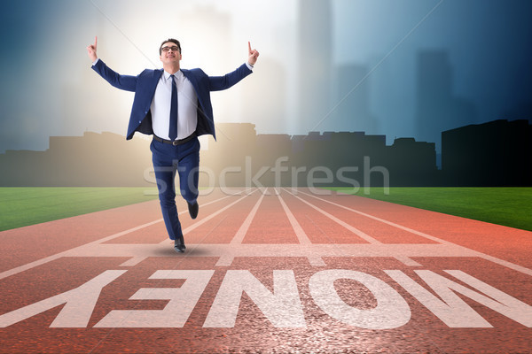 The young businessman chasing money in financial business concept Stock photo © Elnur