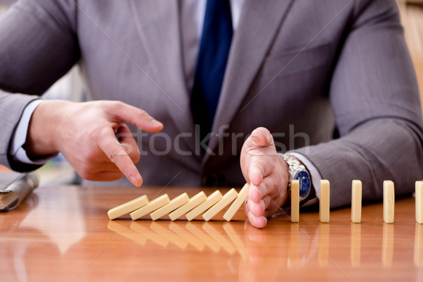 Businessman with dominoes in the office Stock photo © Elnur