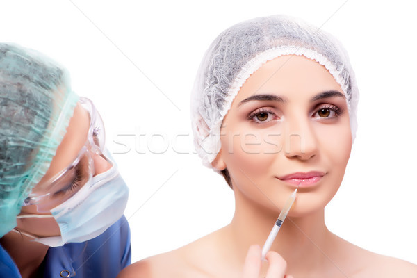 Fiatal nő plasztikai sebészet izolált fehér kéz szem Stock fotó © Elnur