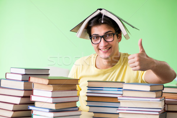 Student with too many books to read before exam Stock photo © Elnur