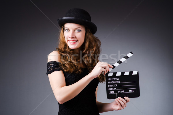 Woman with movie clapper board Stock photo © Elnur