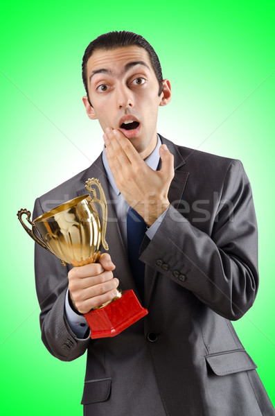 Man being awarded with golden cup Stock photo © Elnur