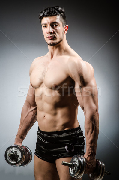 мышечный Культурист гантели спорт фитнес здоровья Сток-фото © Elnur