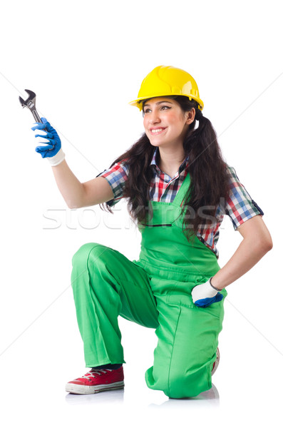 Female workman in green overalls holding key isolated on white Stock photo © Elnur
