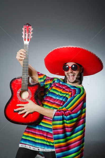 Mexican playing guitar wearing sombrero Stock photo © Elnur