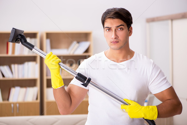 Stockfoto: Man · schoonmaken · home · stofzuiger · gelukkig · werk