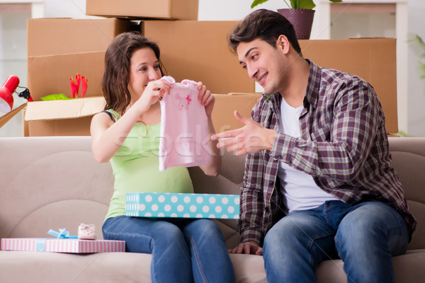Young couple of man and pregnant wife with giftbox Stock photo © Elnur