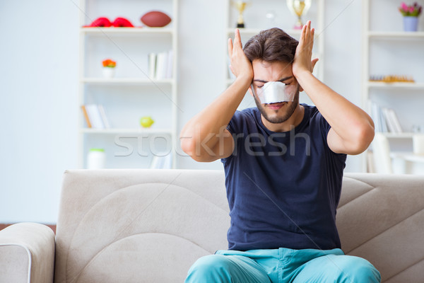 Young man recovering healing at home after plastic surgery nose  Stock photo © Elnur