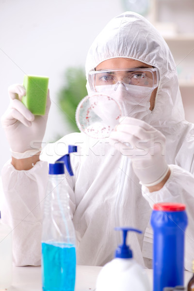 Chemist checking the quality of bathroom supplies Stock photo © Elnur