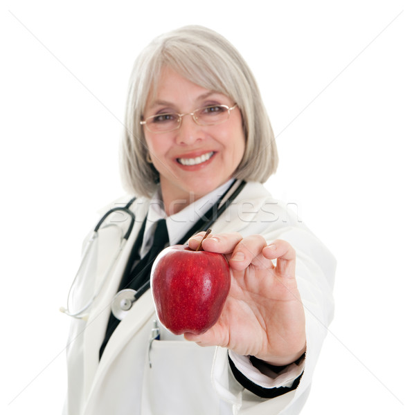 Maturo femminile medico mela guardando Foto d'archivio © elvinstar