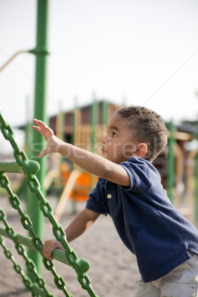 Multi-racial boy at the park Stock photo © elvinstar