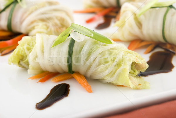 Cabbage roll appetizers with soy sauce garnish Stock photo © elvinstar