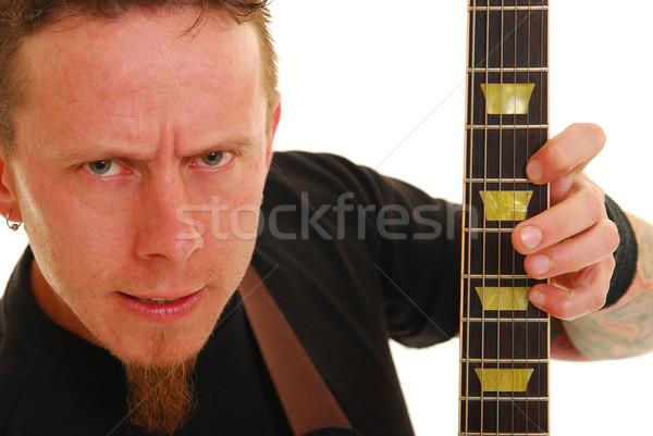 Heavy metal guitarrista caucasiano homem tatuagens brasão Foto stock © elvinstar