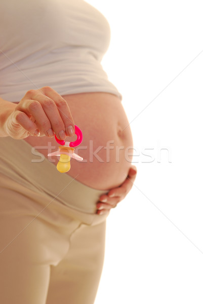 Ciąży kobieta w ciąży profil różowy pacyfikator Zdjęcia stock © elvinstar