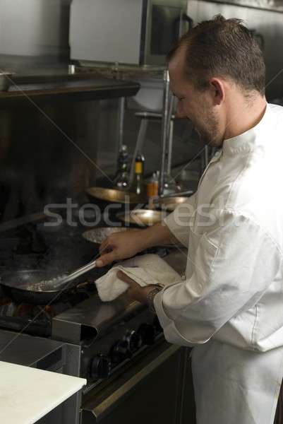 Stock photo: Chef cooking tuna