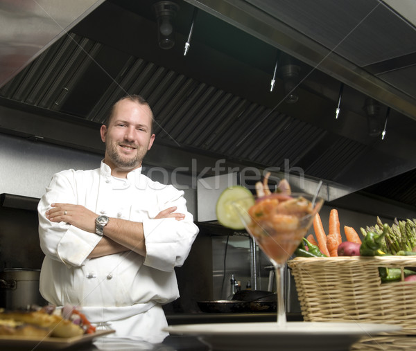 Smiling chef with fresh vegetables Stock photo © elvinstar
