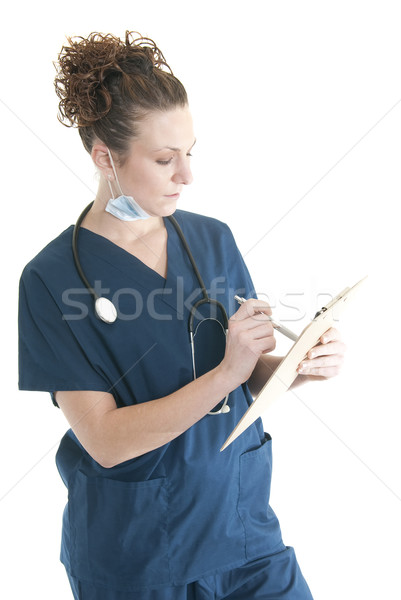 Verpleegkundige schrijven aantrekkelijk kaukasisch vrouw Stockfoto © elvinstar