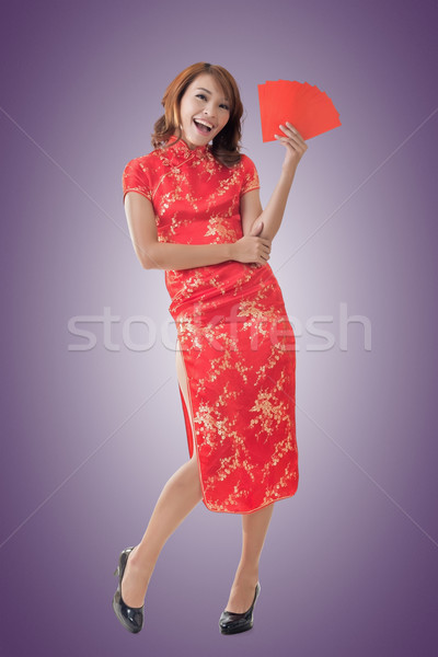 Chinese woman dress cheongsam and hold red envelope Stock photo © elwynn