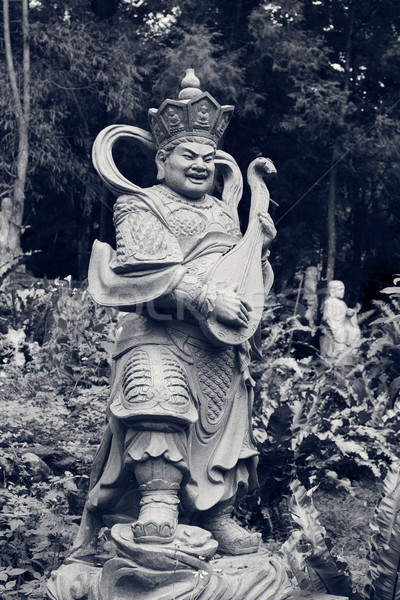 Aged asian god statue Stock photo © elwynn