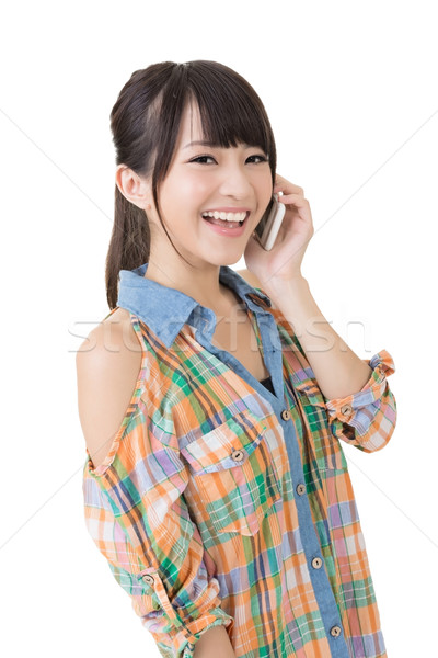 Pretty asian woman talking on cell phon Stock photo © elwynn