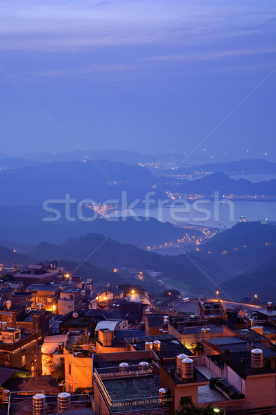 şehir gece sahne evler tepe sarı mavi gökyüzü Stok fotoğraf © elwynn