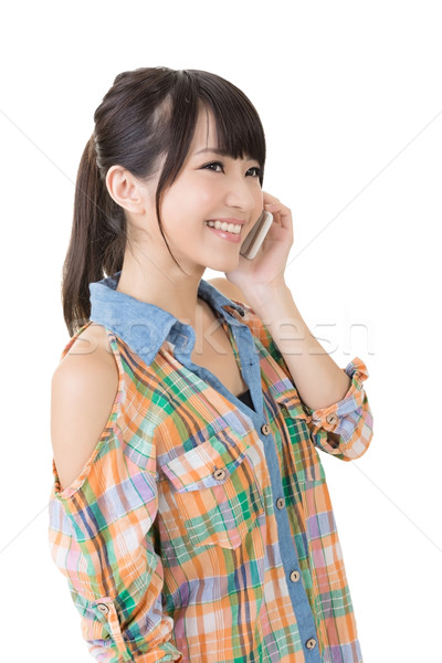 Young pretty asian woman talking by mobile phone Stock photo © elwynn