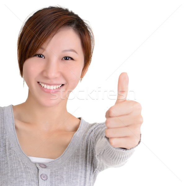 Heureux asian jeune femme donner excellente geste [[stock_photo]] © elwynn