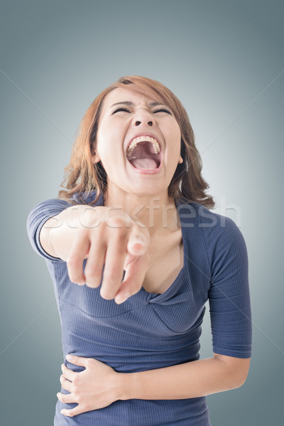 Stock photo: woman pointing and laughing at you