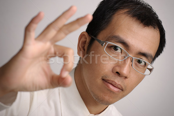 Manager give you a Ok gesture, closeup portrait of Asian business man. Stock photo © elwynn