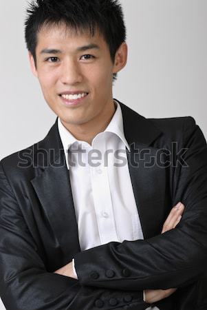 Inmaduro jóvenes hombre de negocios sonriendo primer plano retrato Foto stock © elwynn