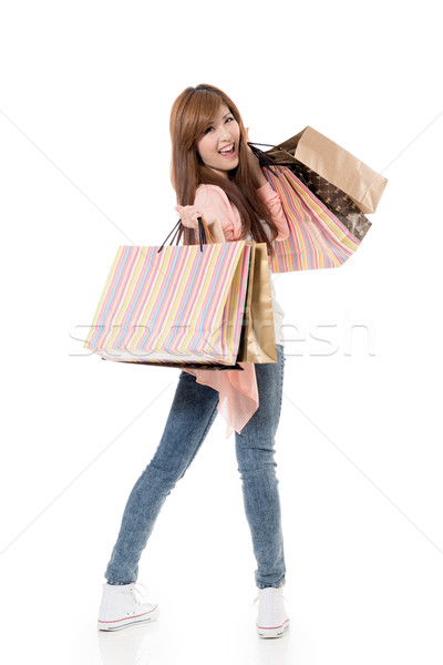 Derűs vásárlás nő ázsiai tart szatyrok Stock fotó © elwynn